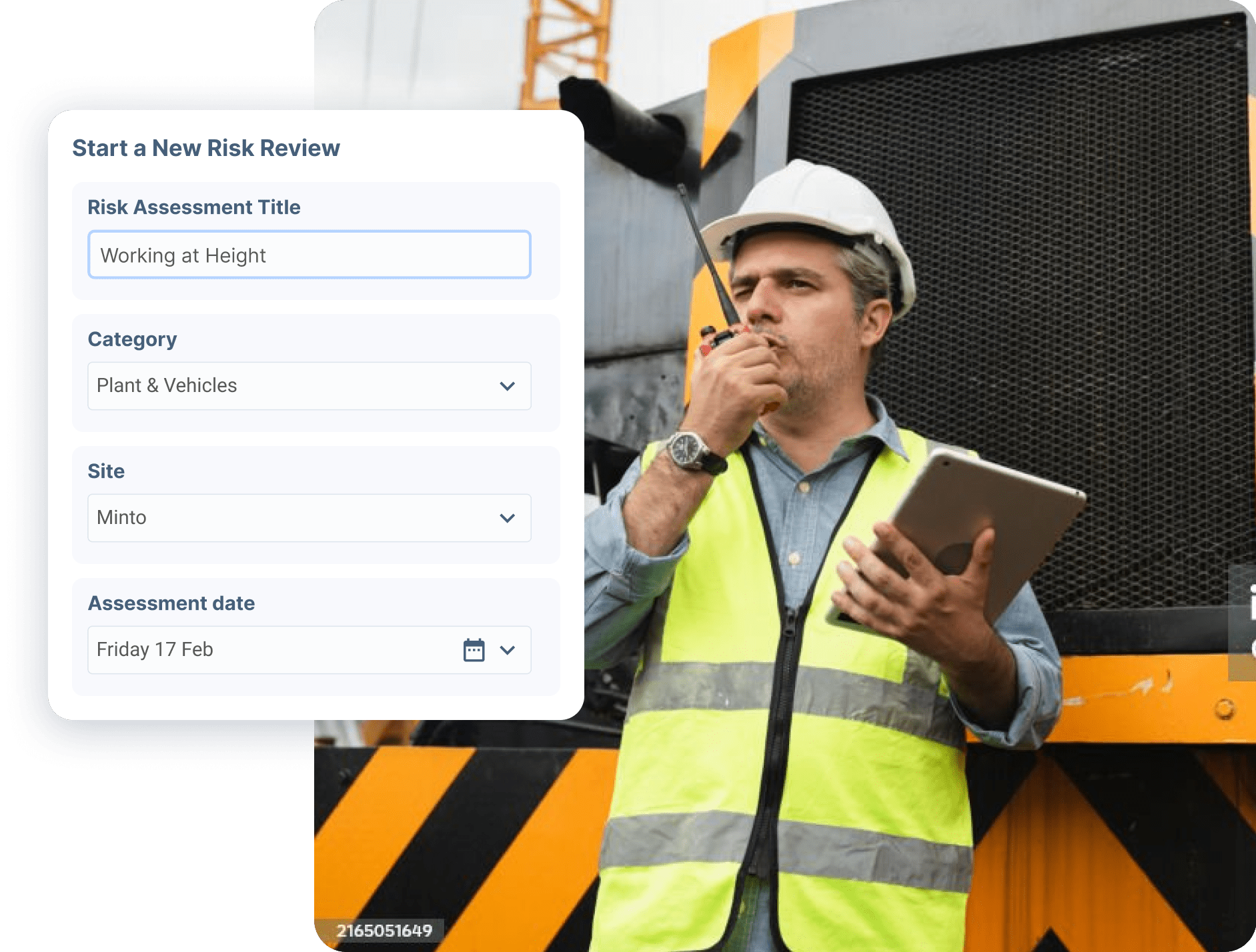 Construction supervisor with radio using risk assessment form on construction site